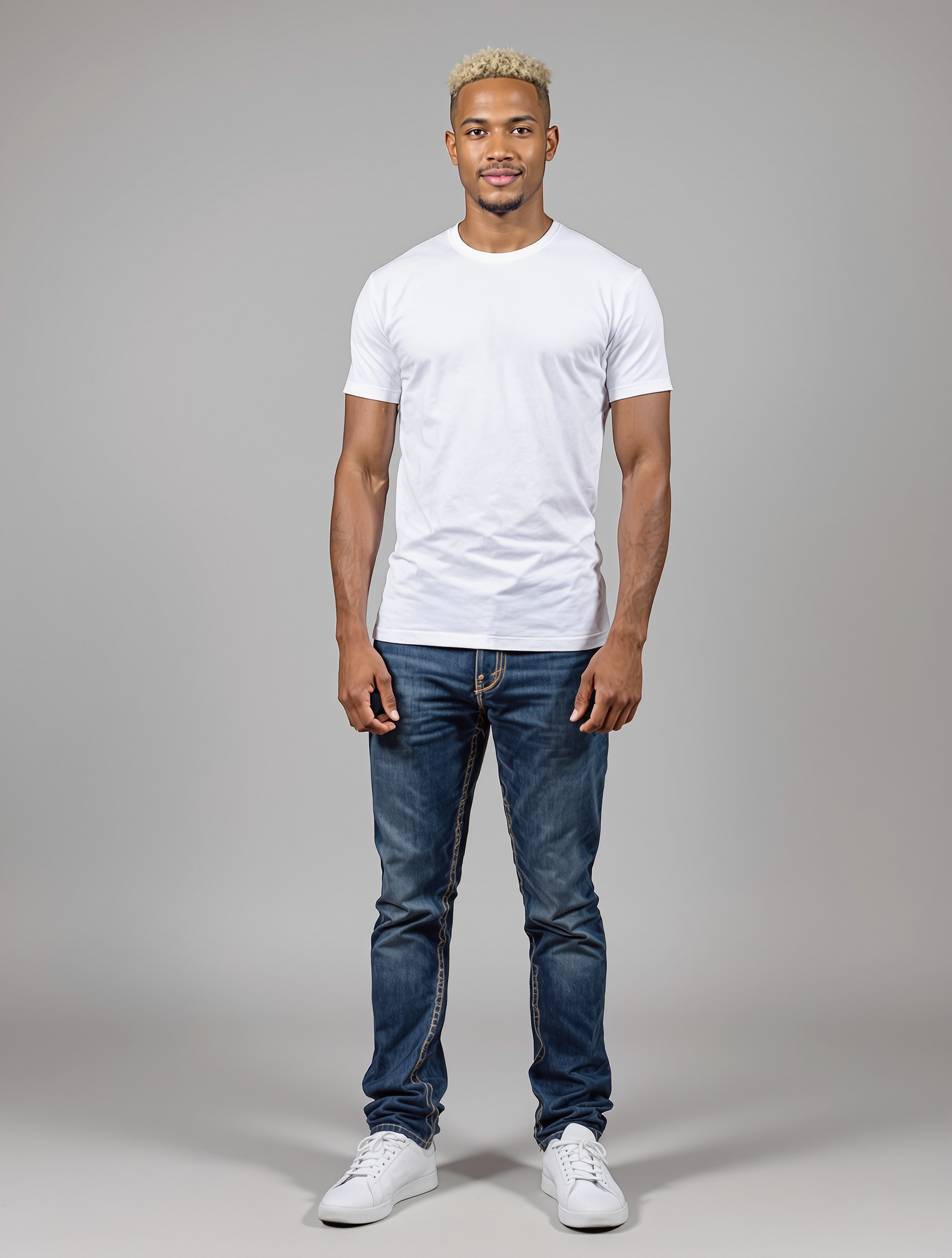 Man in white t-shirt and dark jeans with bleached blonde hair
