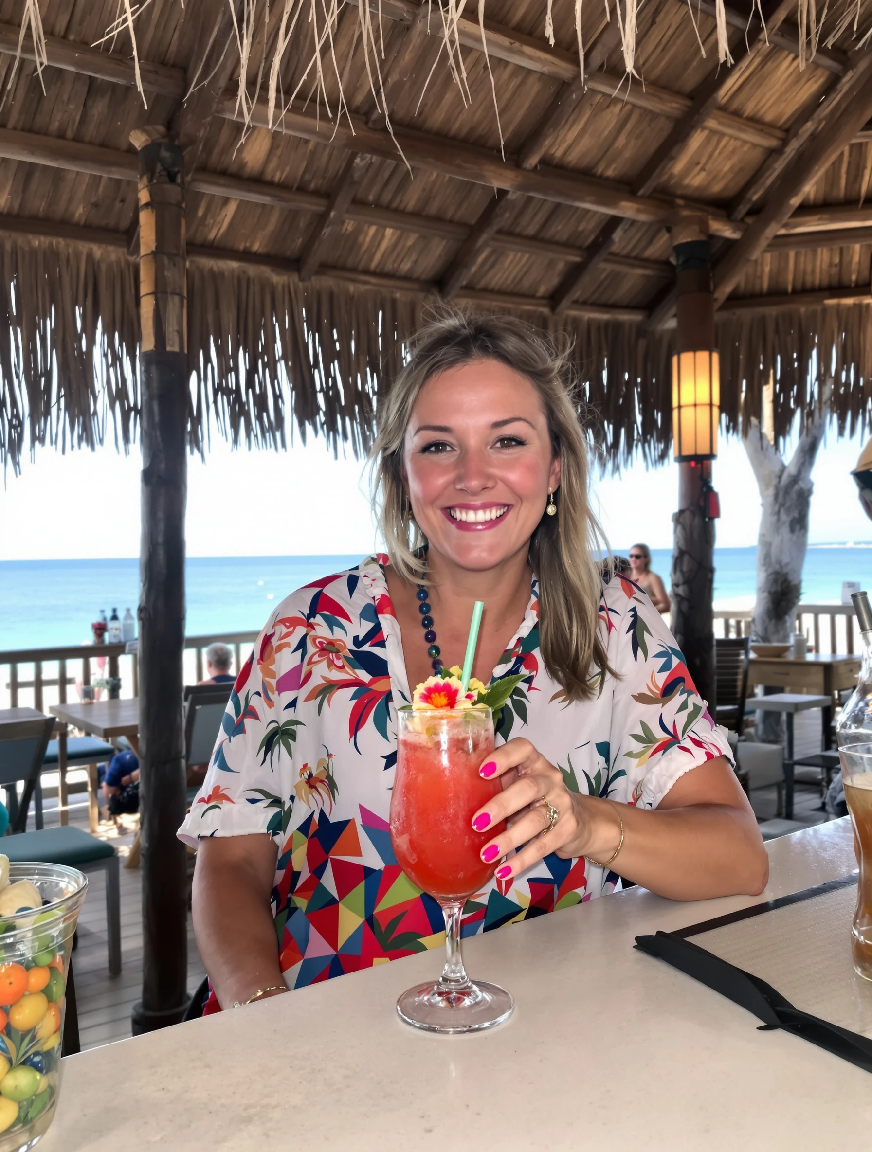 Woman at a tropical beach bar enjoying a colorful cocktail, ocean behind. Casual beach cover-up, tiki bar atmosphere, va