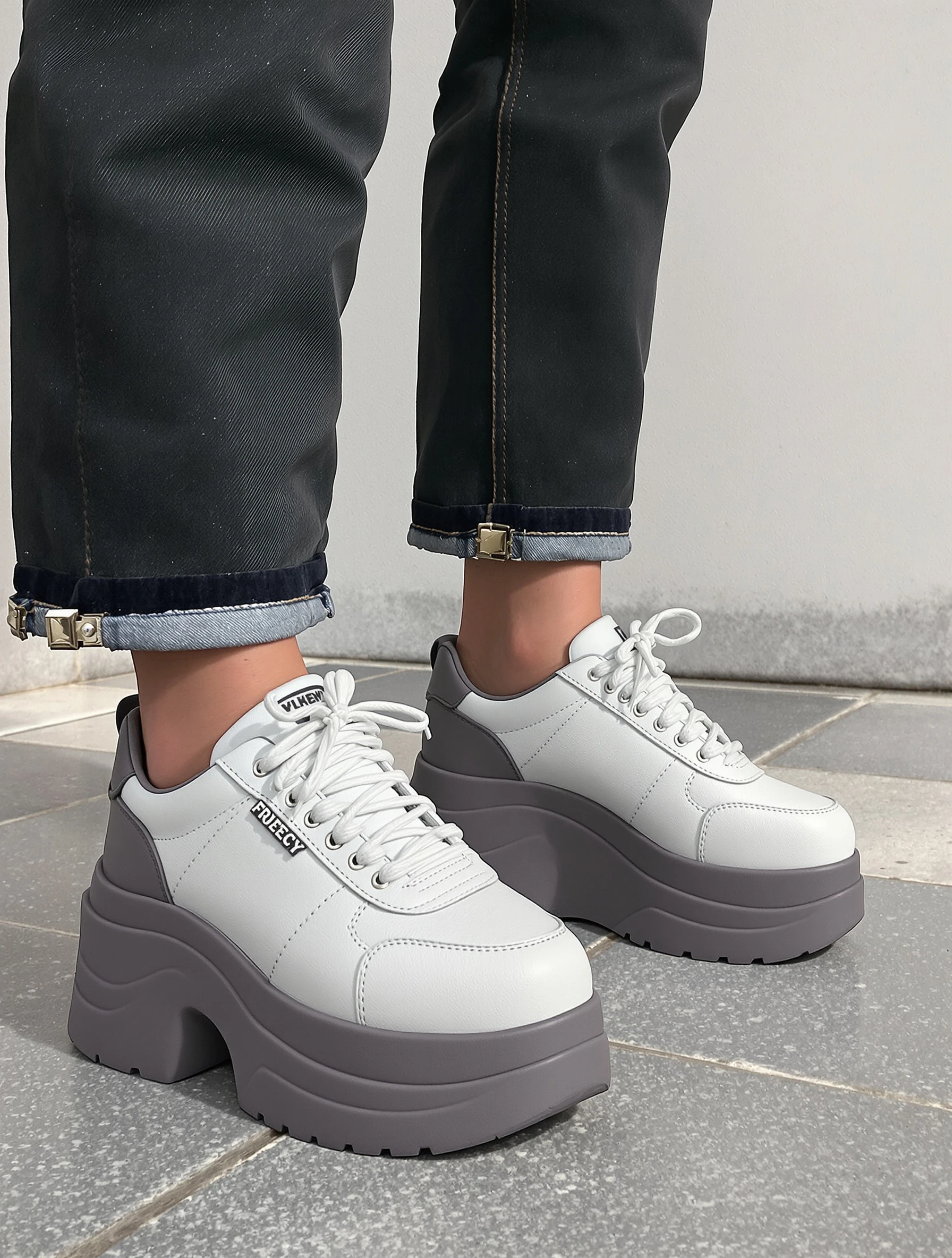 Woman in chunky platform sneakers, exaggerated sole style. Bold footwear choice, fashion forward, statement shoes, trendsetting.