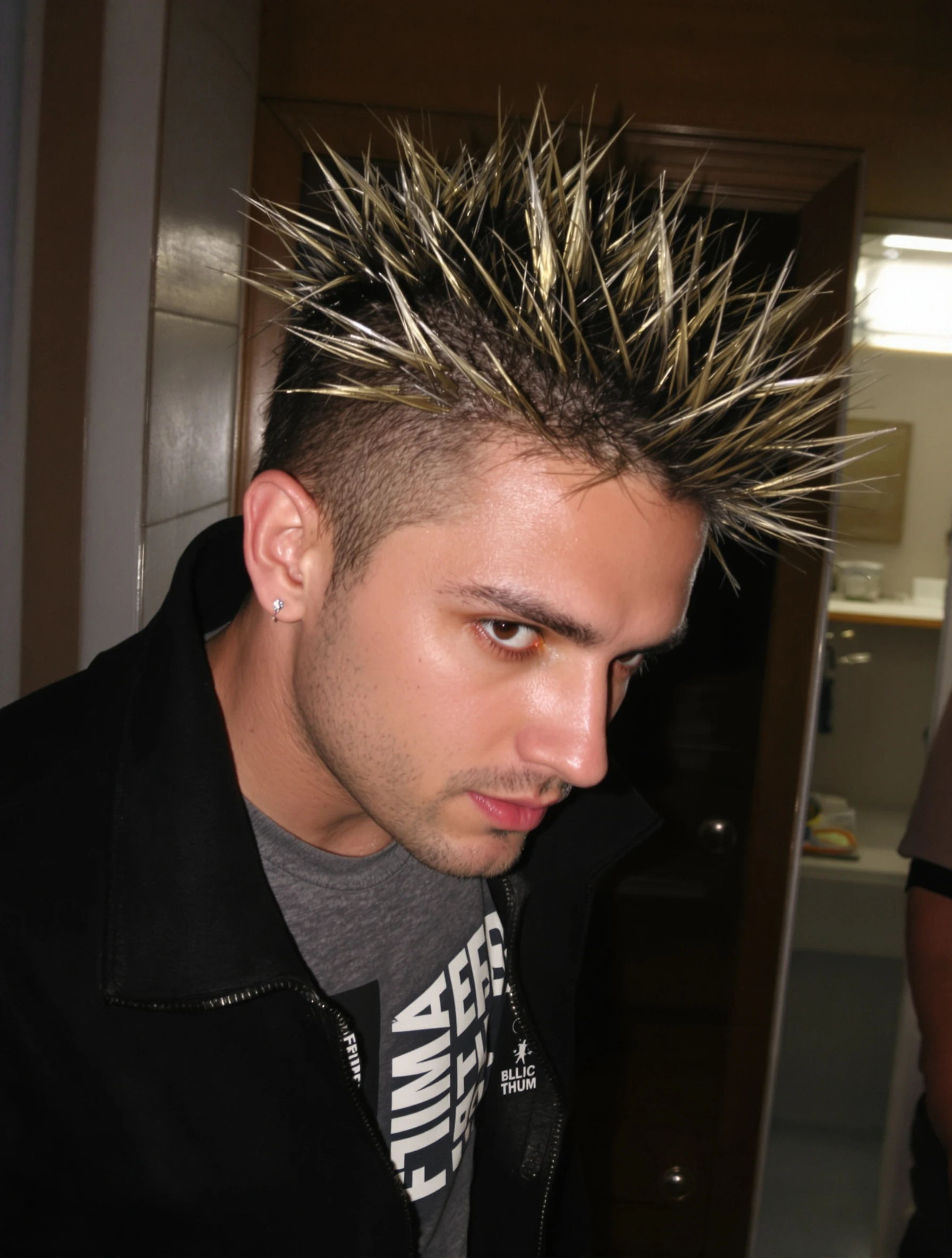 Man with frosted tips and spiky gelled hair, 2000s style. Y2K hair trend, boy band era, styled spikes, millennium look.