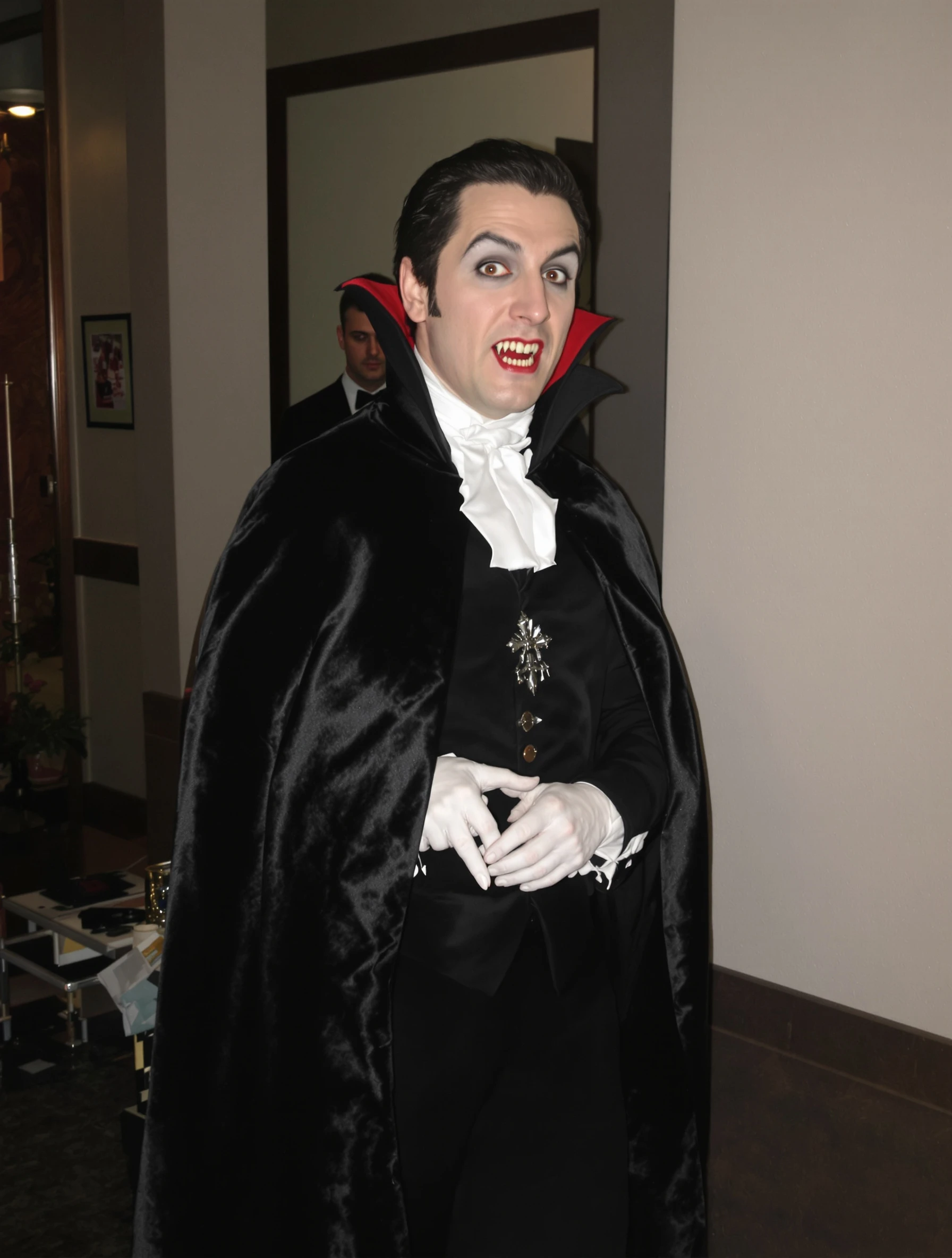 Man in classic vampire costume, Dracula elegance and dark charm. Gothic formal, cape and fangs, immortal style, Halloween sophistication.