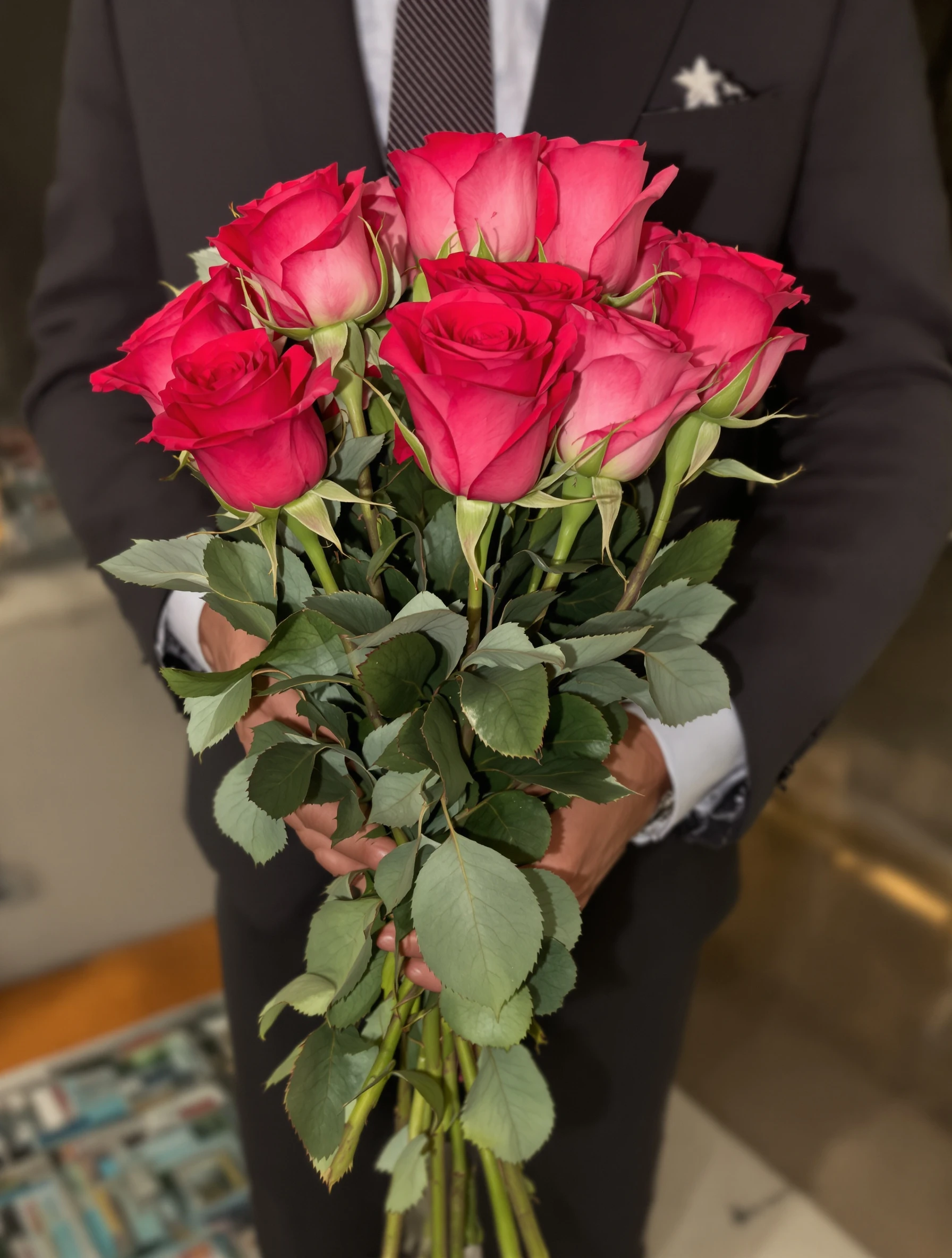 Man in suit holding roses for Valentine's date, romantic gesture. Traditional romance, flower delivery, dressed up, love expressed.
