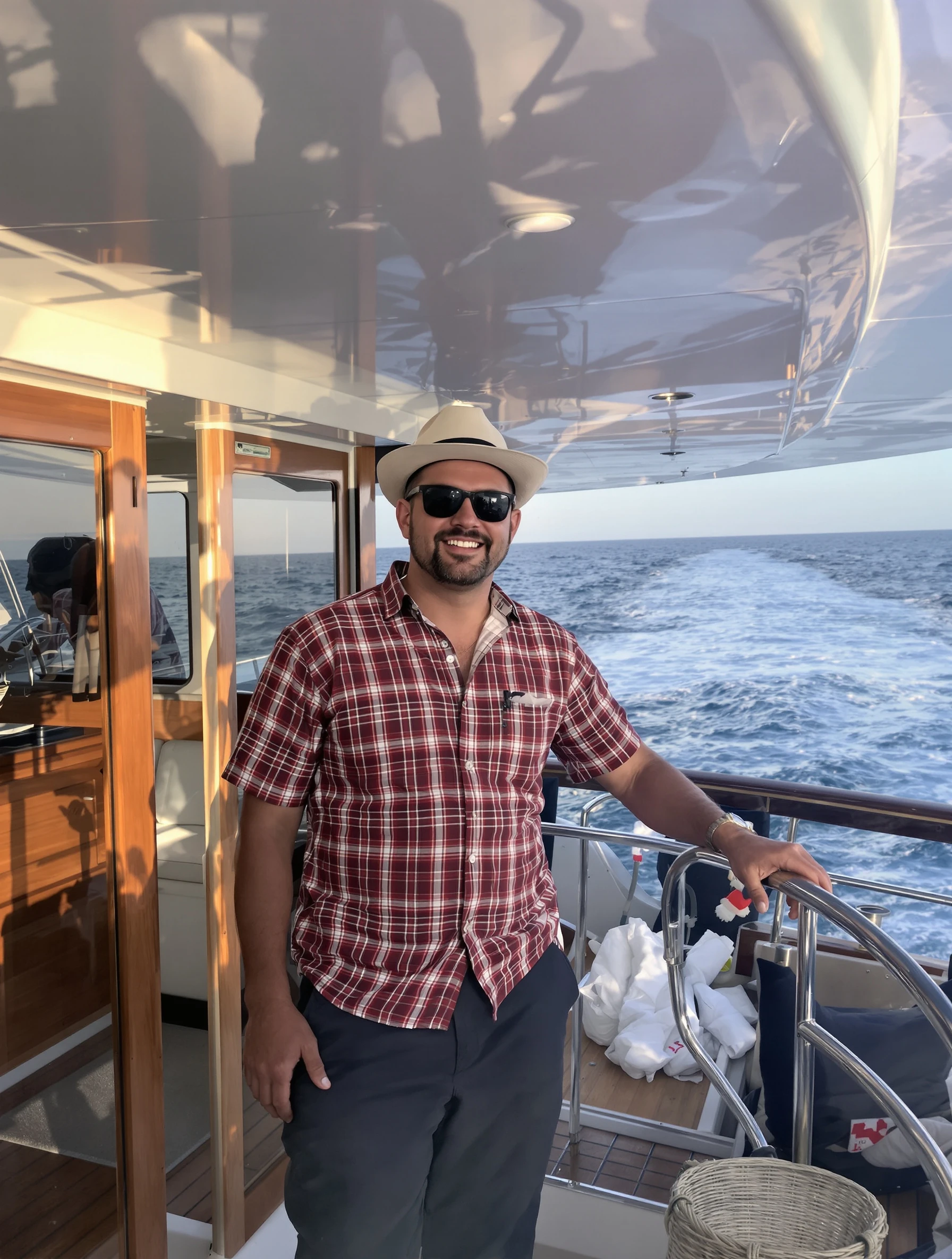 Man on deck of luxury yacht, captain of his domain. Nautical casual elegance, open sea, vessel ownership, maritime lifestyle.
