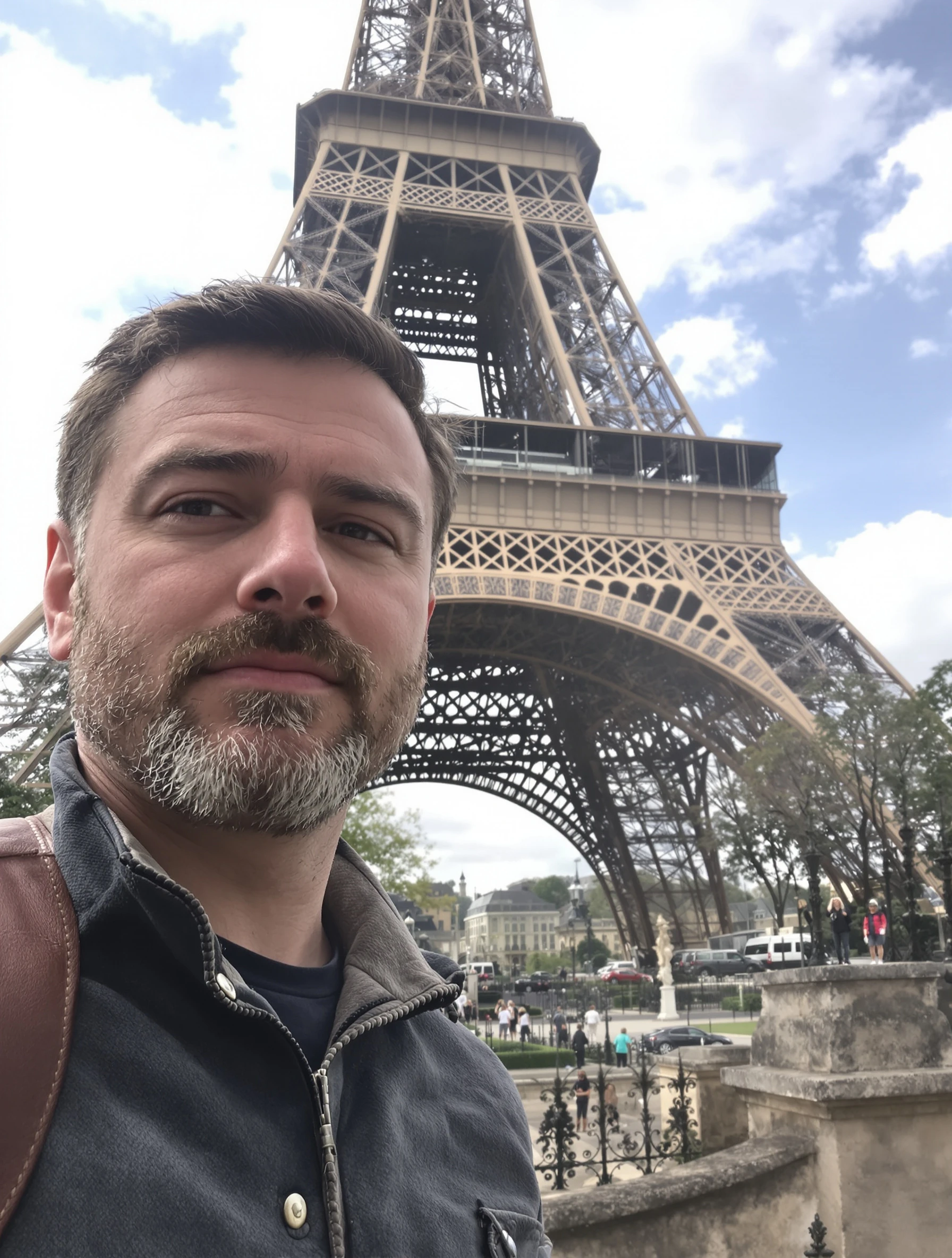 Man exploring Paris with Eiffel Tower behind, casual traveler style. Leather messenger bag, curious explorer expression,
