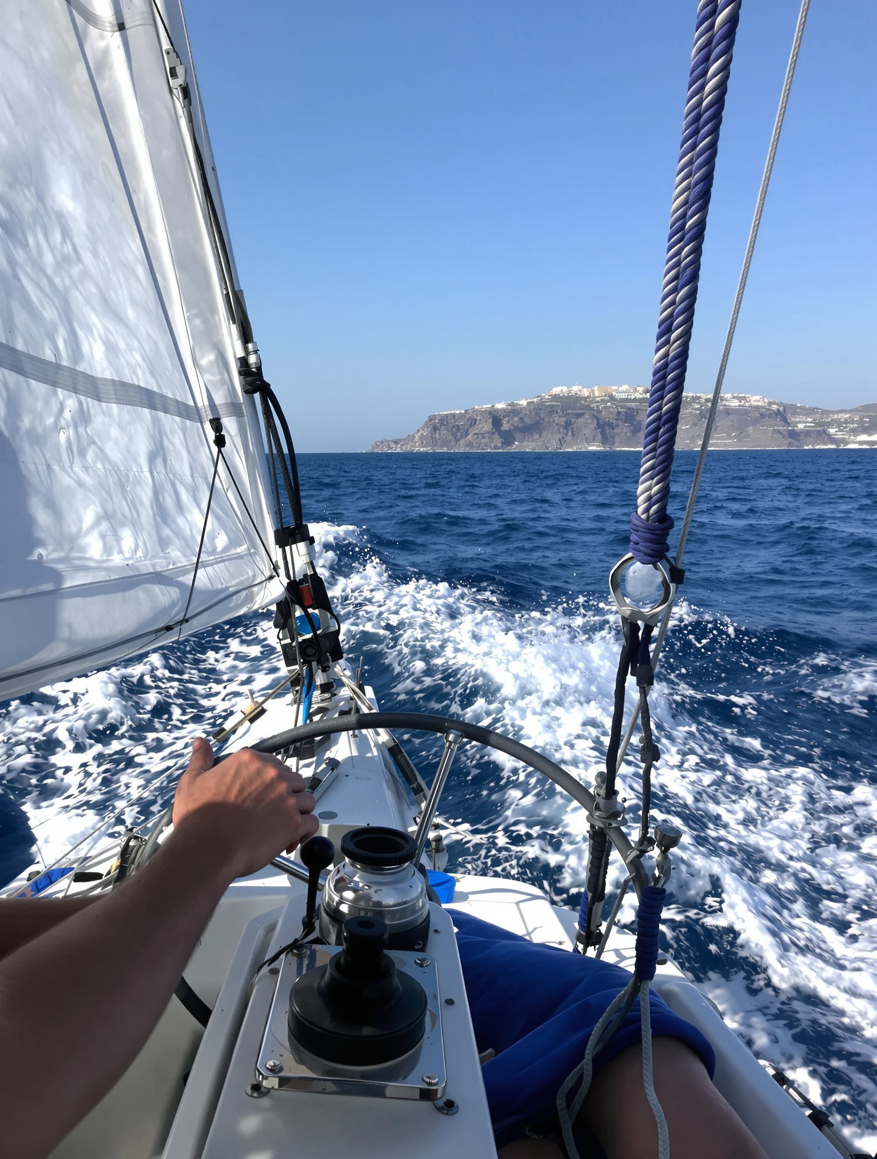 Man sailing the Aegean Sea near Santorini, hands on wheel. Nautical casual, boat cutting through blue waters, adventure and freedom.